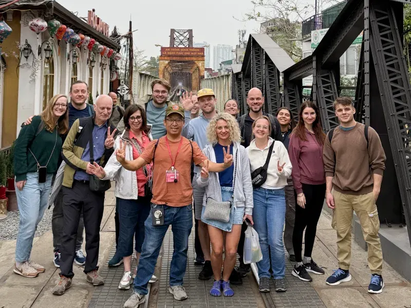 A local guide walking with travelers through Vietnam