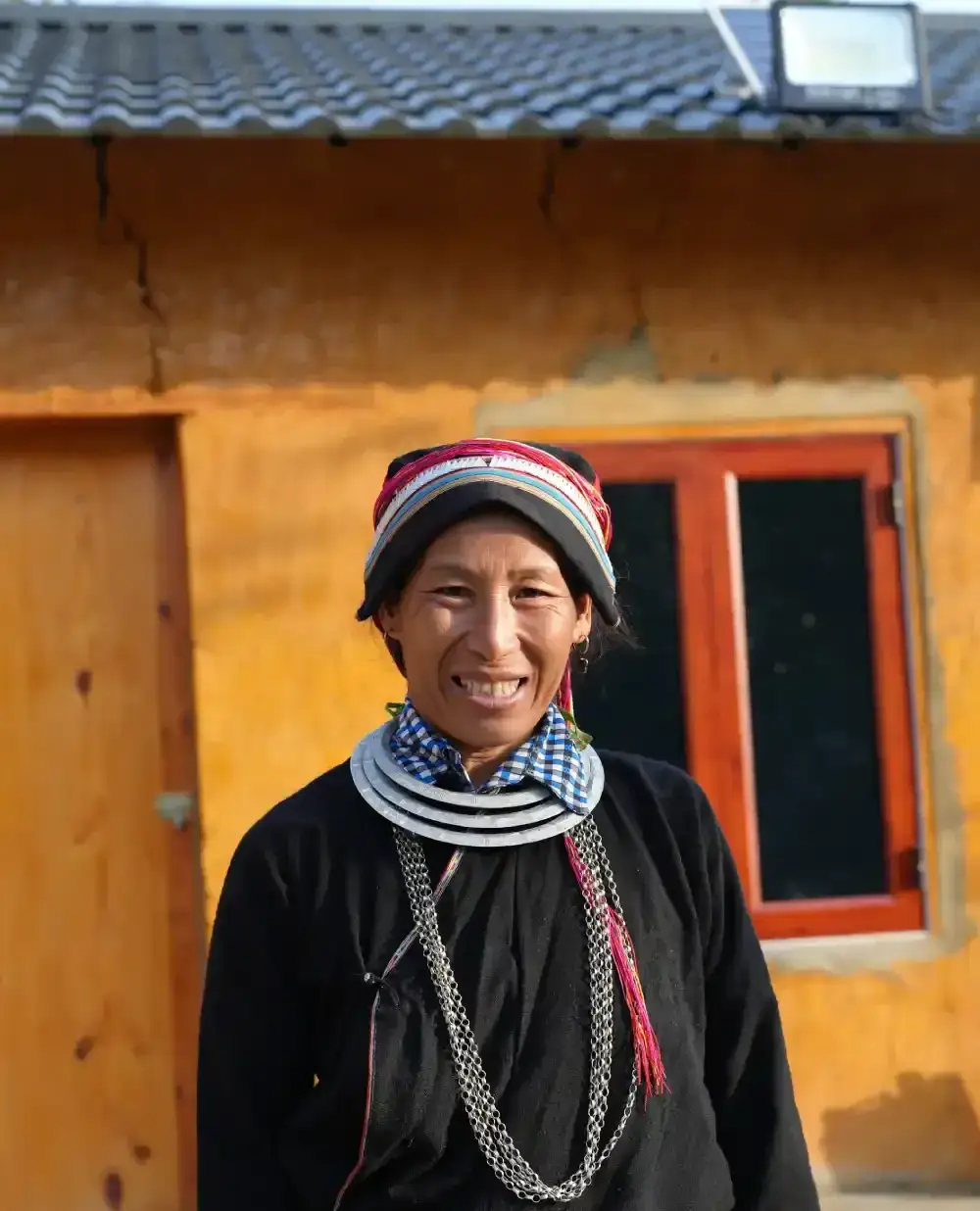 Tay and Hmong family preparing a shared meal in a traditional stilt house in northern Vietnam